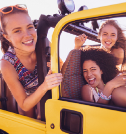 Young people riding in a Jeep