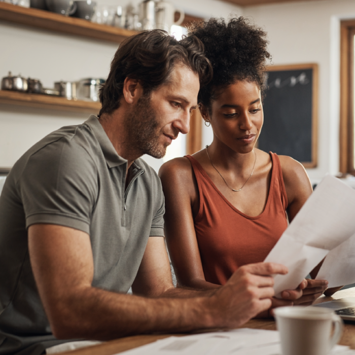 Couple applying for a loan on the computer