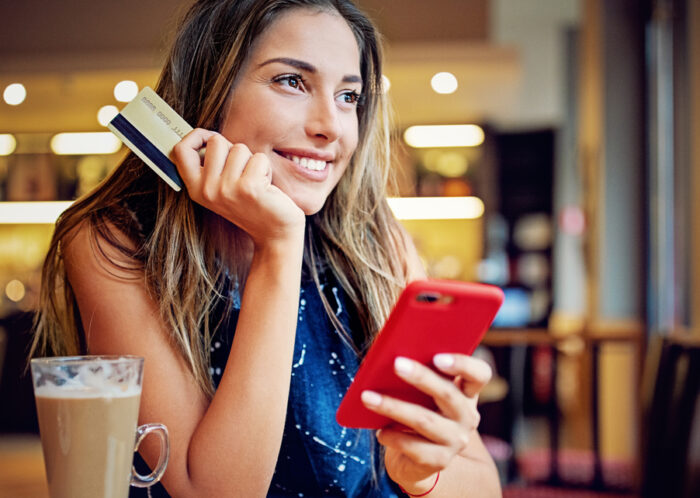 girl with card and phone