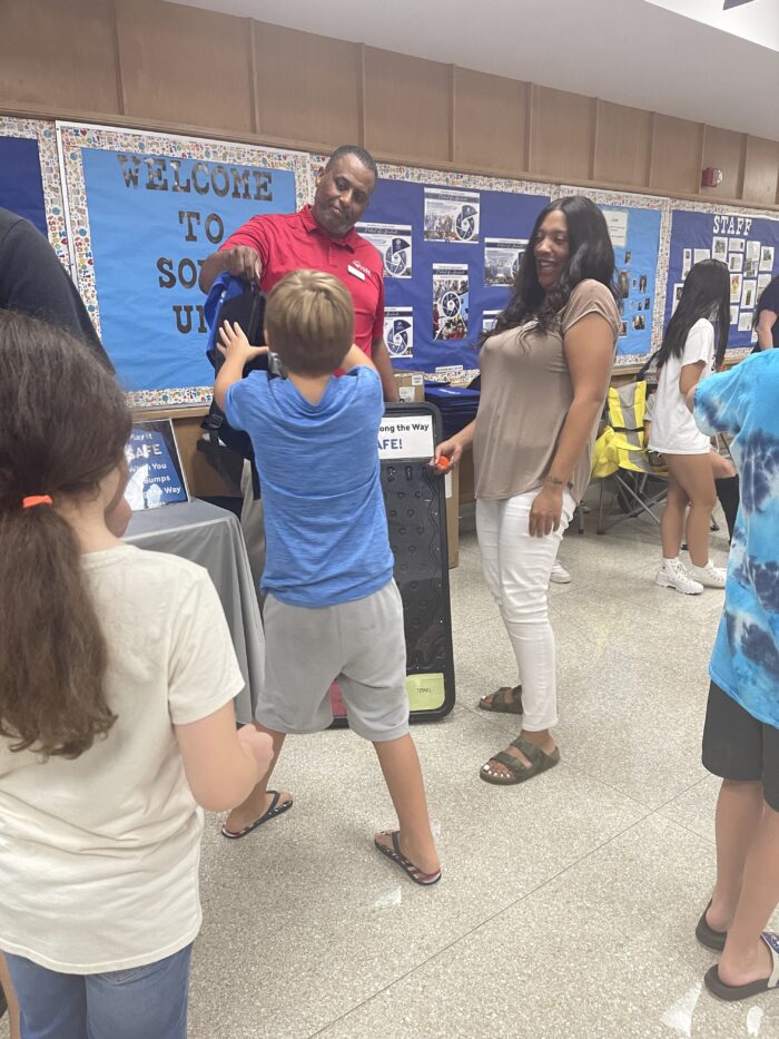 Fred and Monique playing a game at a Kettering back to school event