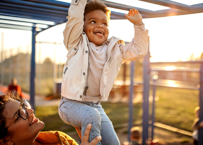 kid on monkey bars