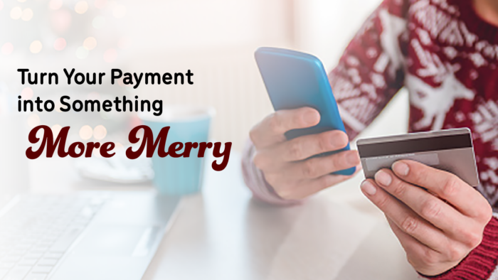 Skip a Pay Image Person holding a phone and card